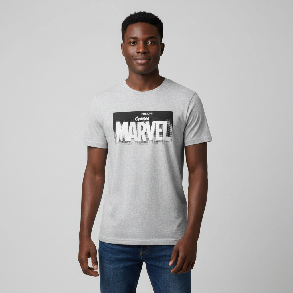 Young Nigerian male wearing light grey Marvel Comics For Life graphic crew neck tee