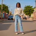 Nigerian girl model wearing floral knit cardigan and daisy jeans set