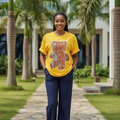 Nigerian female model wearing yellow sequin teddy bear graphic tee and navy wide-leg trouser co-ord set