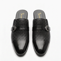 Pair of men’s black buckle cap-toe mule shoes