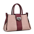 Blush-pink textured handbag with burgundy handles and silver-tone ring clasp on white