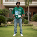 Nigerian male model wearing forest green editorial all-over print graphic tee – front view