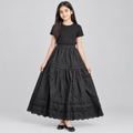 Child model wearing black tiered lace-hem skirt