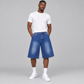 Model wearing blue faded denim long shorts