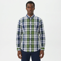 Adult Black model wearing a navy green and white plaid long-sleeve shirt