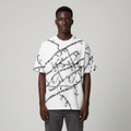 Black Nigerian model wearing the white chain-print polo shirt