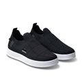 Pair of black knit slip-on sneakers with white soles on a pure-white background