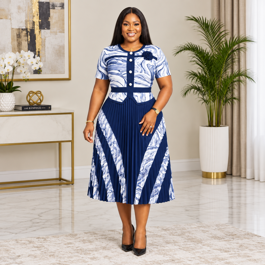 Adult Black woman wearing a navy and white patterned pleated dress