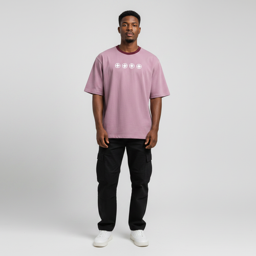 Young Nigerian male wearing dusty mauve Spacedive Explorer Astrospace oversized graphic tee
