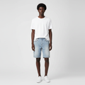 Man wearing the light wash eyelet denim shorts