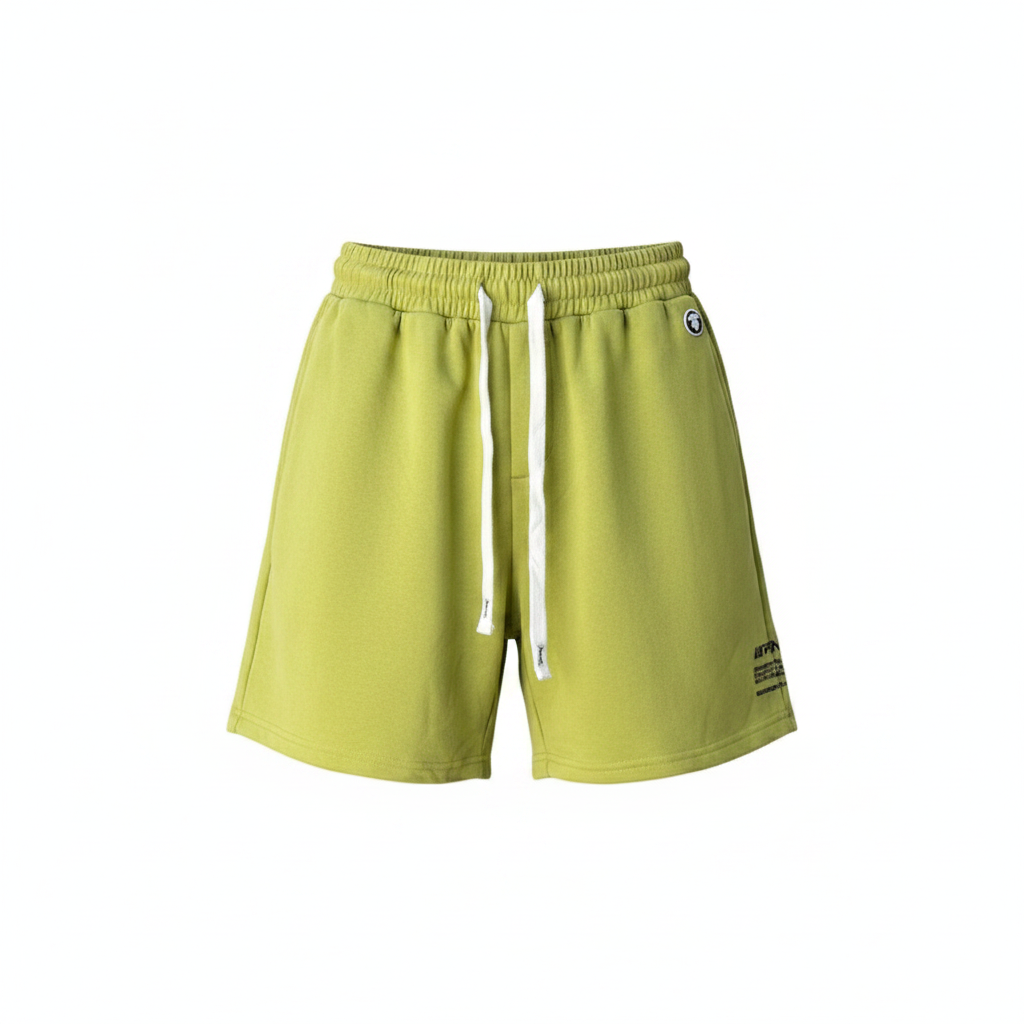 Ghost mannequin front view of lime green fleece drawstring shorts with circle logo badge and black text print
