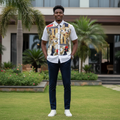 Nigerian male model wearing white abstract floral graphic short-sleeve shirt