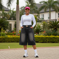 Nigerian female model wearing black wide-leg denim jorts - front view