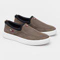 Taupe perforated slip-on shoe pair on a clean background
