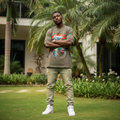 Nigerian male model wearing olive x-ray skull graphic oversized tee – front view