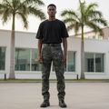 Model wearing dark camo carpenter straight-leg jeans