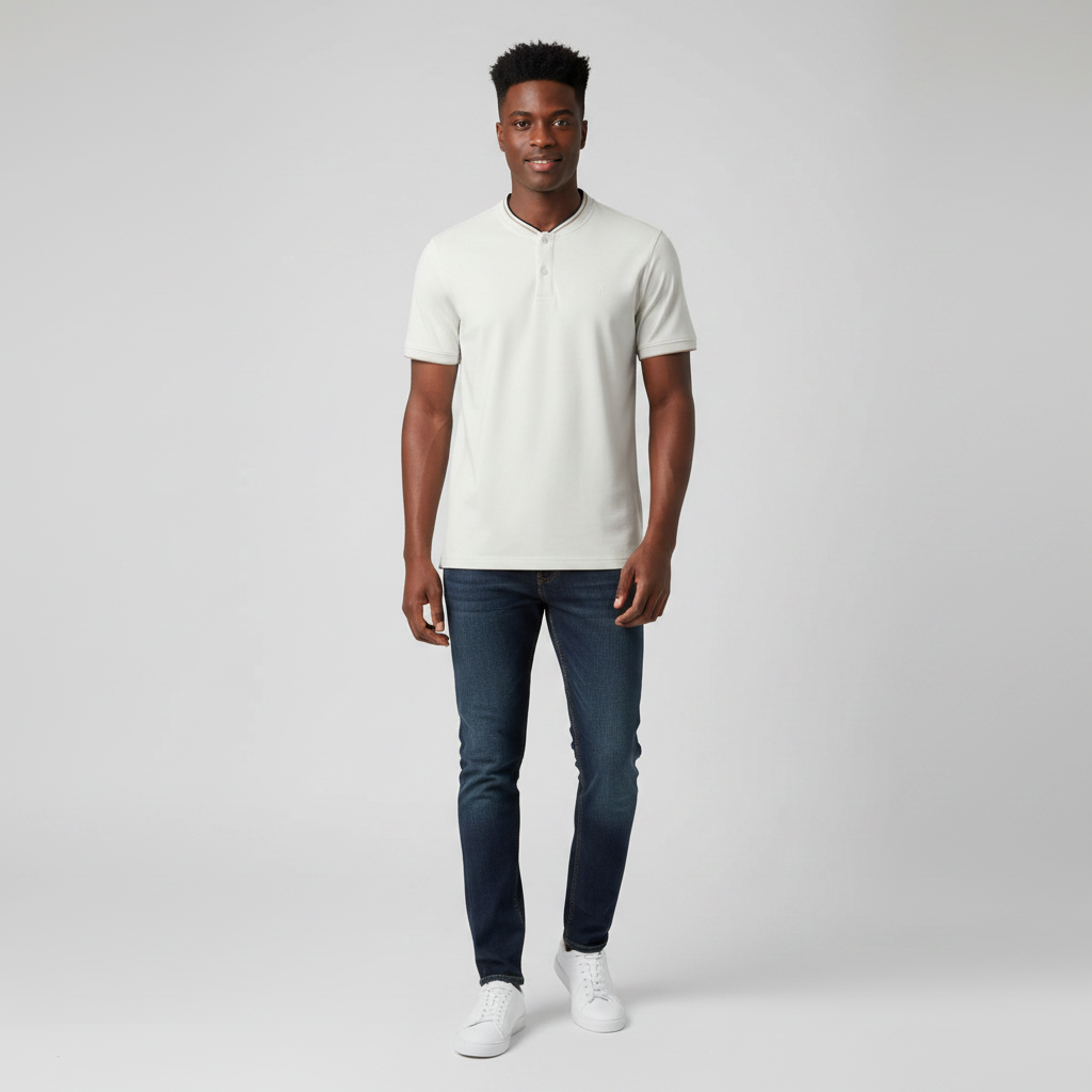 Young Nigerian male wearing light stone Henley black tipped polo shirt