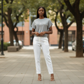 Young Nigerian female wearing grey rhinestone bow knit cap sleeve top