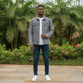 Nigerian male model wearing grey washed denim trucker jacket