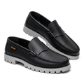 Pair of black contrast-stitch loafers with grey lug soles on a white background