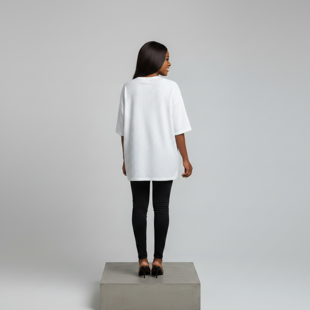 Nigerian female model back view - white rhinestone Mickey motif top