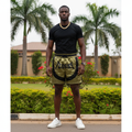 Nigerian male model wearing olive camo graphic shorts outdoors