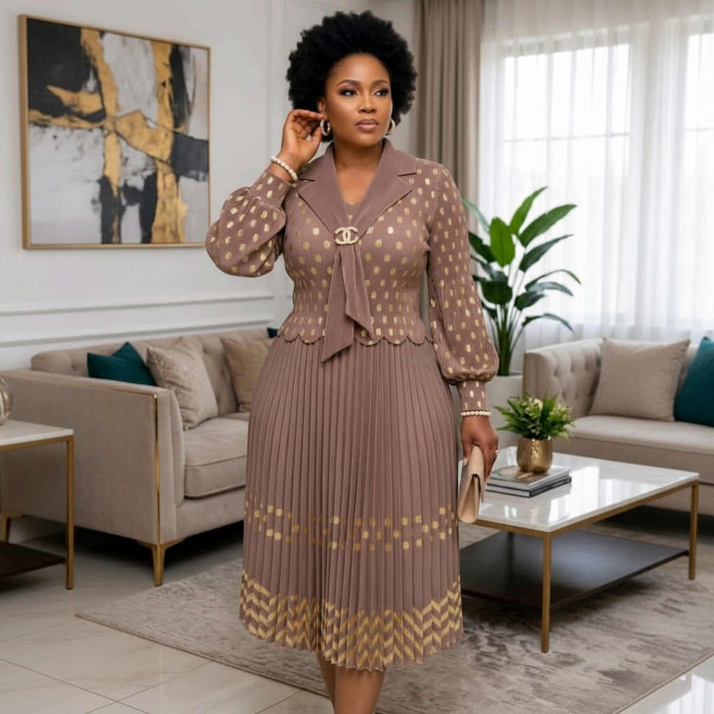 Nigerian woman wearing mocha brown and gold polka dot peplum top and pleated midi skirt set