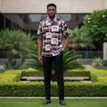 Nigerian male model wearing black equestrian grid print short-sleeve shirt