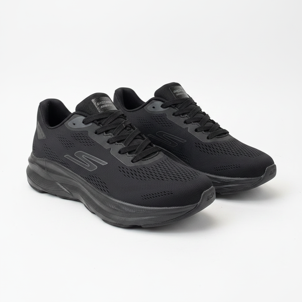All-black knit running sneakers with cushioned sole, centred on a plain off-white background