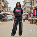 Young Nigerian female model wearing black pink mesh graphic cargo set