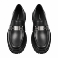 Pair of black loafers with silver-tone clasps and chunky soles