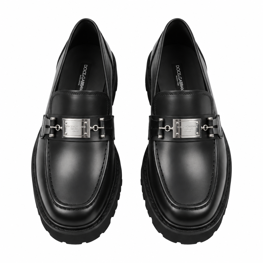 Pair of black loafers with silver-tone clasps and chunky soles