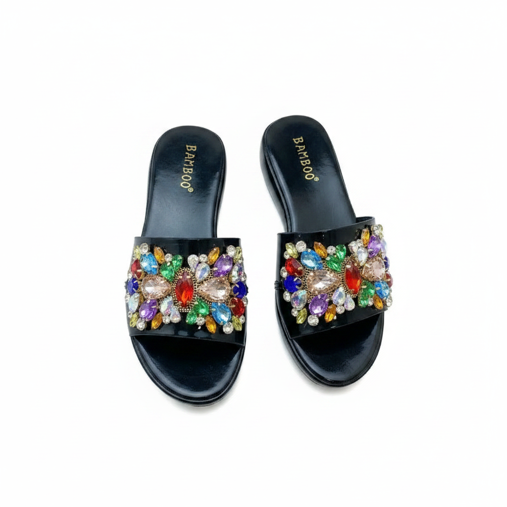 Ghost mannequin pair view of black patent leather wedge slide mules with multicolour gemstone rhinestone floral strap
