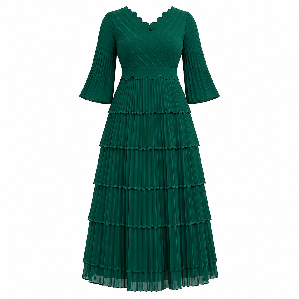Emerald green scalloped tiered pleated dress on white background