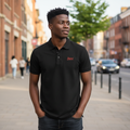 Young Nigerian male model wearing black polo with red script logo