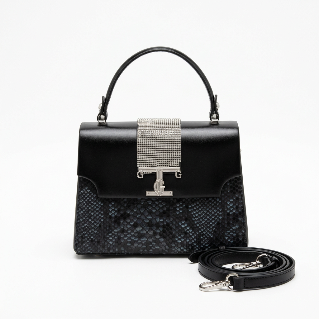 Black top-handle bag with snake-pattern panel, silver-tone crystal-style detail and separate black strap on white
