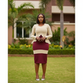 Nigerian female model wearing cream and burgundy scallop peplum colour-block midi dress
