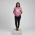 Nigerian female model front view wearing dusty pink mythological face graphic T-shirt