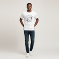 Young Nigerian male wearing white Los Angeles West Coast California graphic crew neck tee