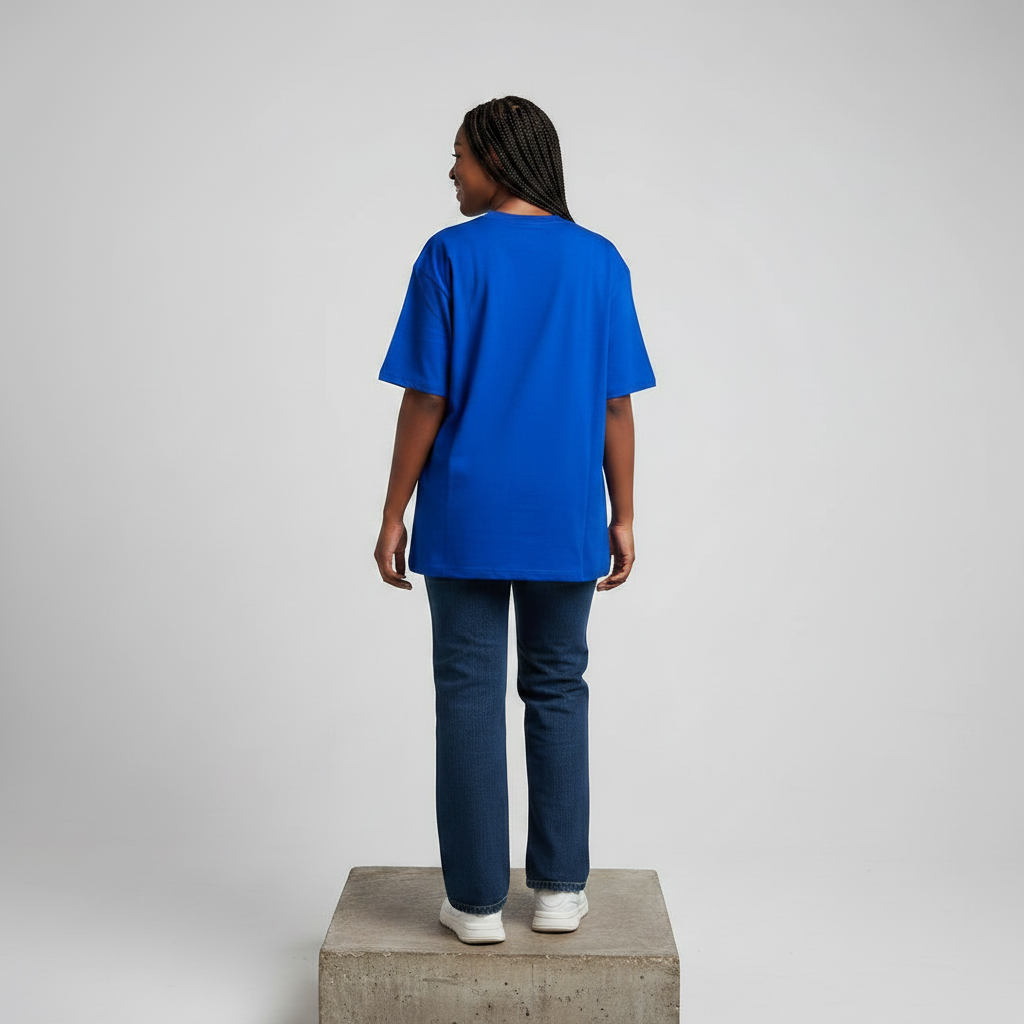 Nigerian female model back view wearing plain royal blue T-shirt - consistent model