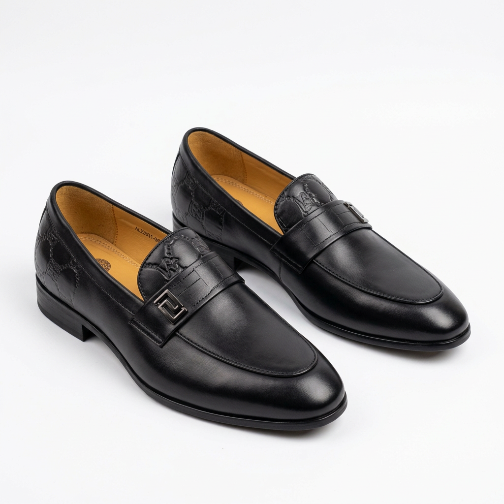 Pair of black textured-trim square-accent loafers on white