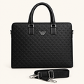 Black embossed top-handle bag with detached shoulder strap