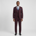 Full-body Black adult model wearing a burgundy textured three-piece suit