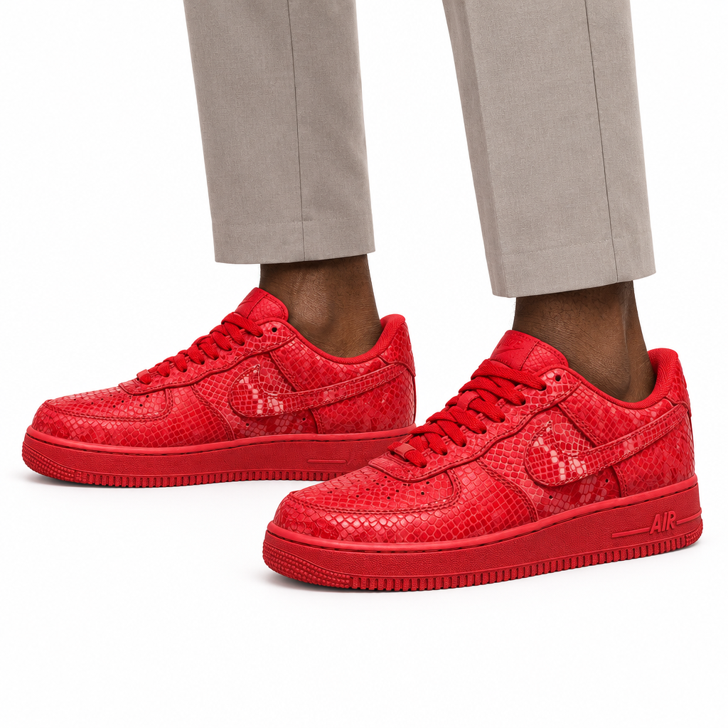 Man wearing red textured low-top sneakers, both feet visible