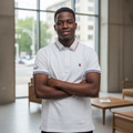 Nigerian male model wearing white tiger polo shirt with tipped collar in upscale setting