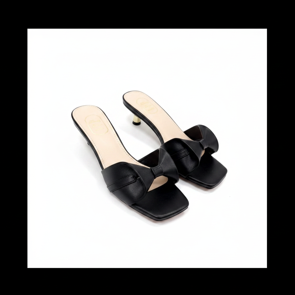 Ghost mannequin pair view of black crossover strap kitten heel slide mules