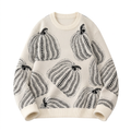 Cream crew-neck knit sweater with oversized black dotted pumpkin motifs
