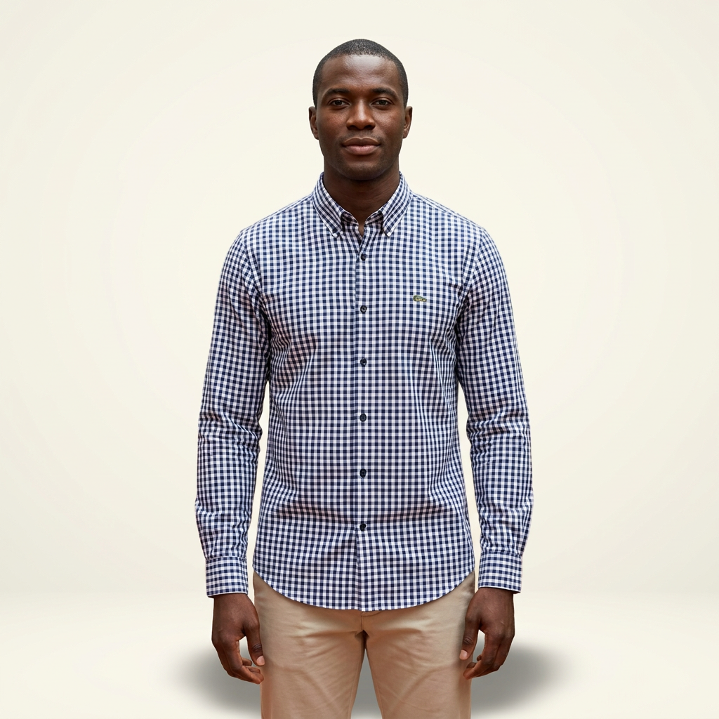 Male model wearing a navy and white gingham long-sleeve shirt against a plain off-white background