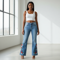 Nigerian female model wearing light blue floral hem flare jeans front view