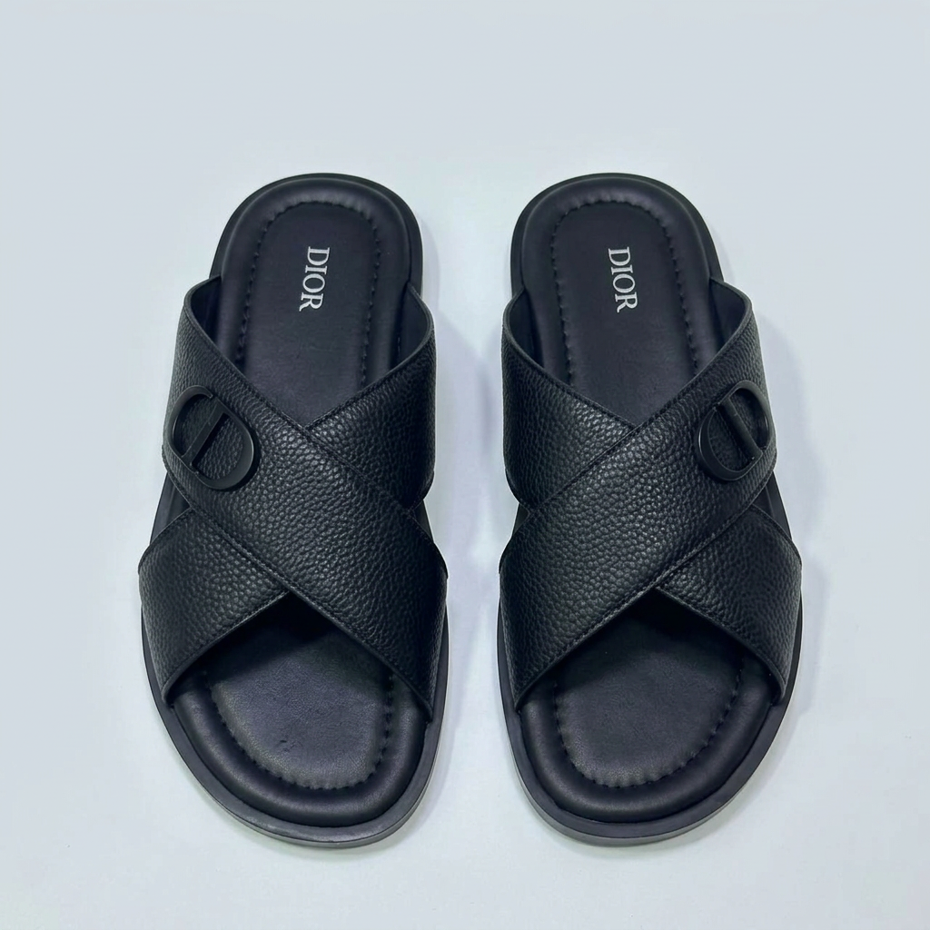 Men's black leather cross-strap slide sandals with monogram emblem, front view